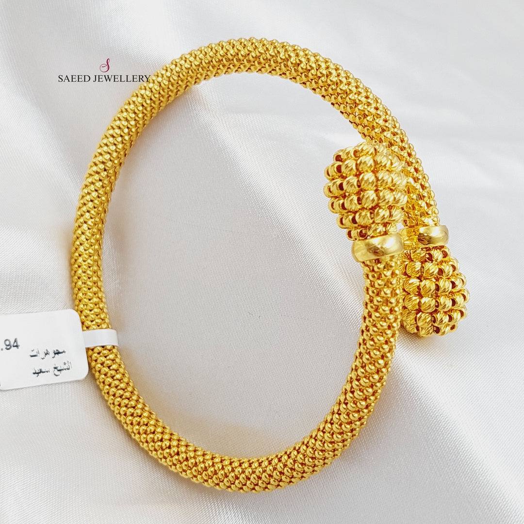 21K Gold Twisted Bangle Bracelet by Saeed Jewelry - Image 1