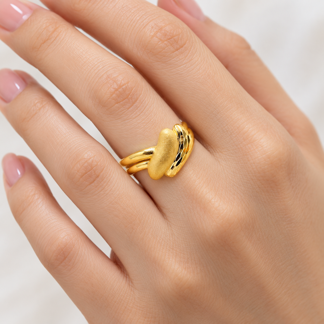 AI-generated try-on simulation of a 21K gold sculpted wave ring with a raised oval front.