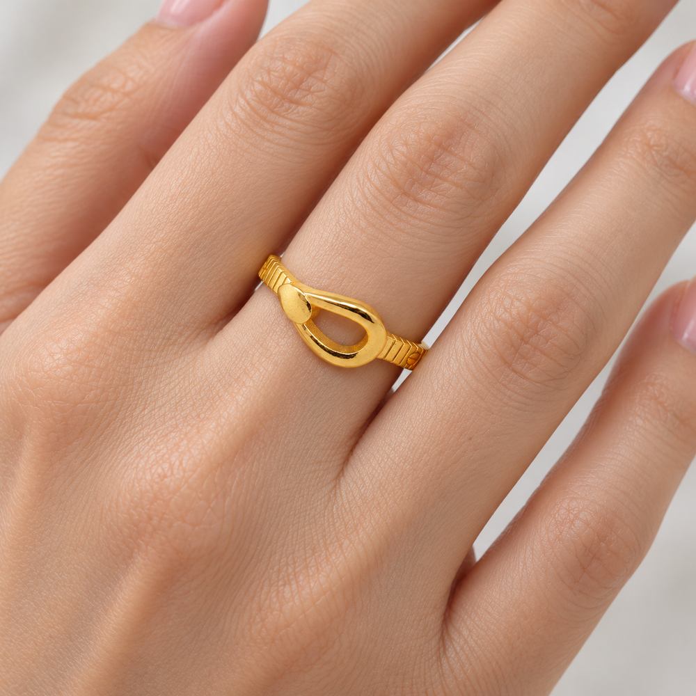 AI-generated try-on simulation of a 21K gold ring with a raised loop and fine textured band.