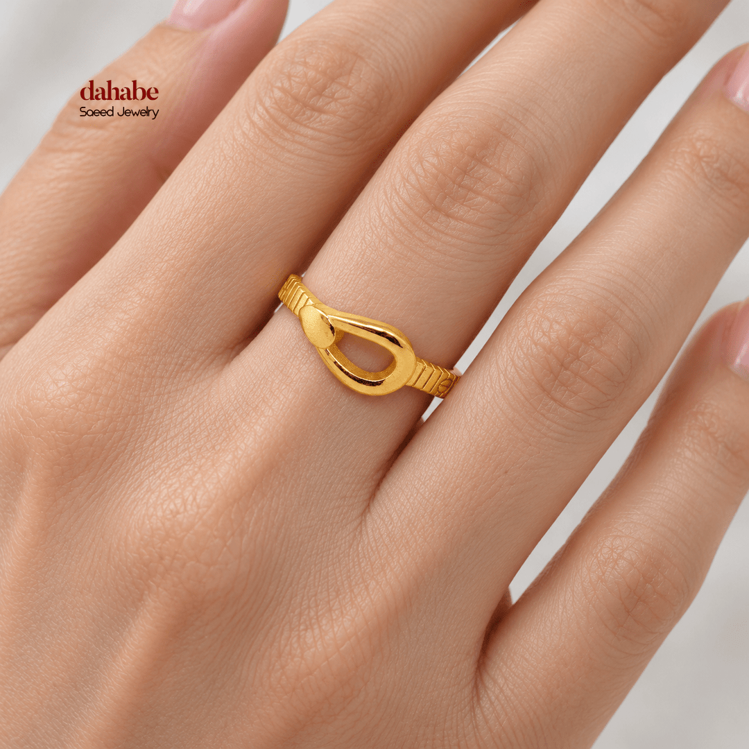 AI-generated try-on simulation of a 21K gold ring with a raised loop and fine textured band.
