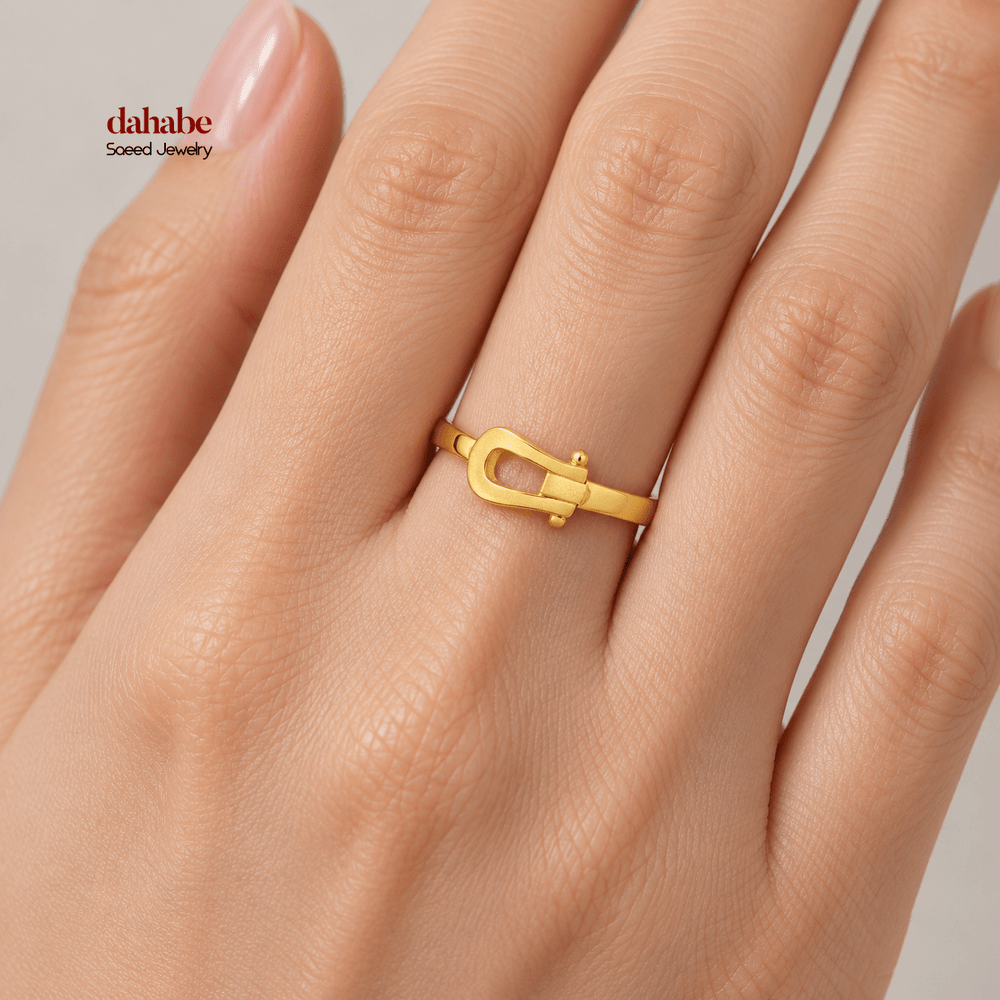 AI-generated try-on simulation of a 21K gold belt ring with an open buckle motif.