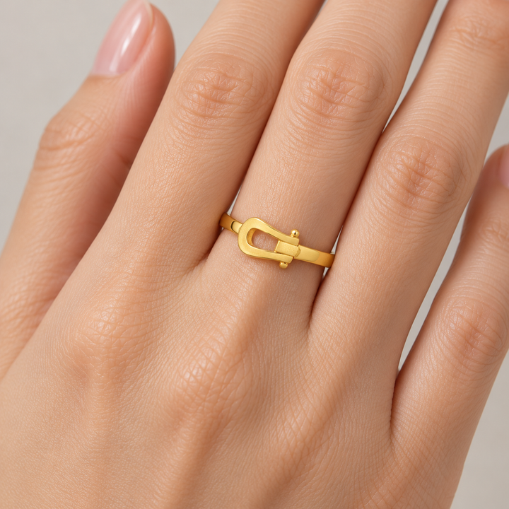 AI-generated try-on simulation of a 21K gold belt ring with an open buckle motif.