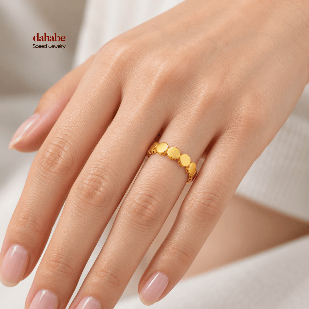 AI-generated try-on simulation of a 21K gold ring with five smooth dome panels and openwork shoulders.