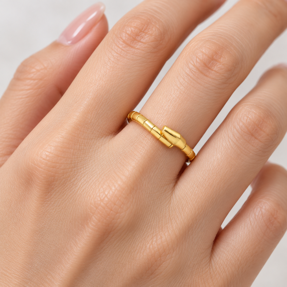 AI-generated try-on simulation of a 21K gold articulated segmented ring with a raised curved front.