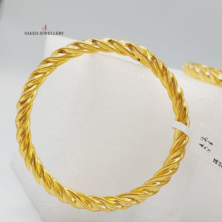 Bold Twisted Hollow Bangle Made Of 21K Yellow Gold<br><br>
<br> by Saeed Jewelry-27899