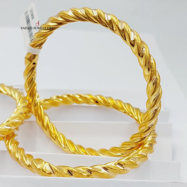 Bold Twisted Hollow Bangle Made Of 21K Yellow Gold<br><br>
<br> by Saeed Jewelry-27899