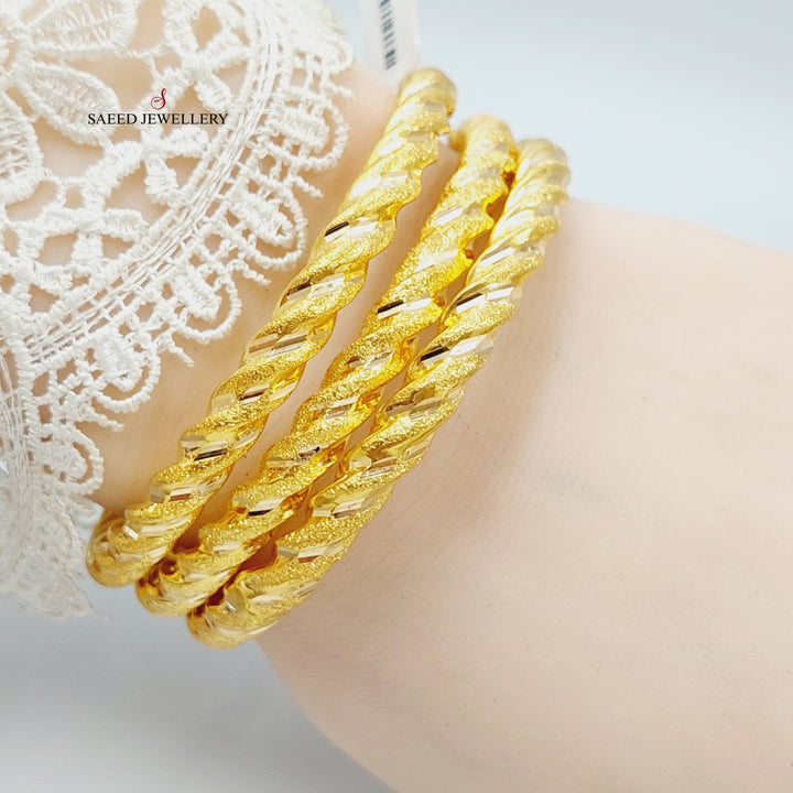 Bold Twisted Hollow Bangle Made Of 21K Yellow Gold<br><br>
<br> by Saeed Jewelry-27899